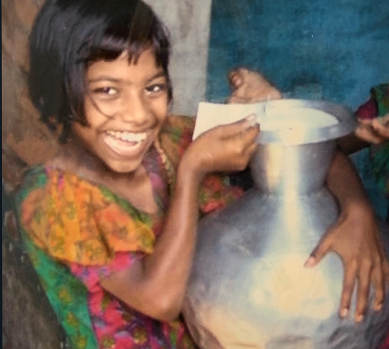 Young girl using Aquatabs for Safe drinking water