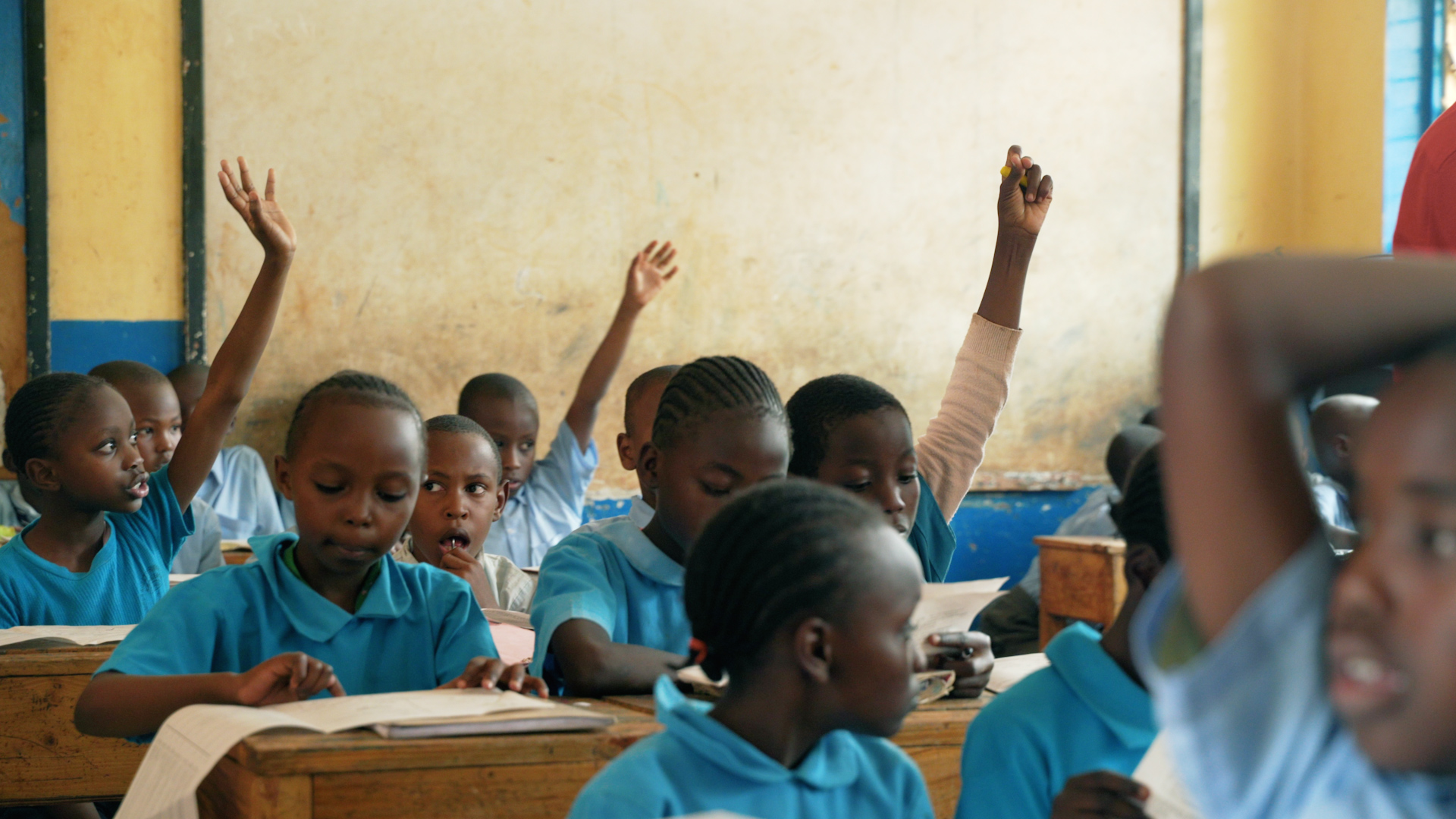 Students in Africa learning about hygiene in a classroom, highlighting the importance of community education.