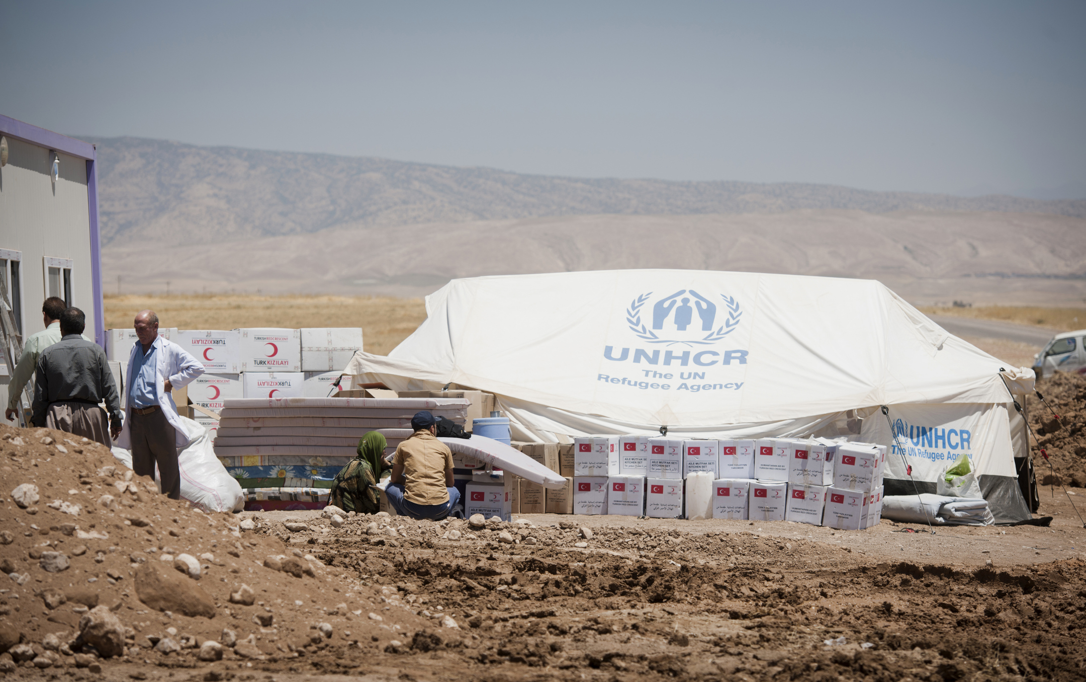 A displacement camp with limited infrastructure, increasing the risk of cholera outbreaks.